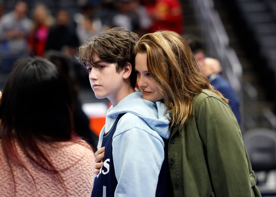 Alicia Silverstone and Bear Blue at a Los Angeles Clippers game in November 2023