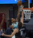 Charlotte Hornets forward P.J. Washington (25) scores over Sacramento Kings forward Nemanja Bjelica (8) during the second half of an NBA basketball game in Sacramento, Calif., Sunday, Feb. 28, 2021. The Hornets won 127-126. (AP Photo/Randall Benton)