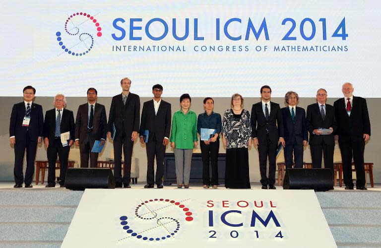 South Korean President Park Geun-Hye (in green) poses with the winners of the Fields Medals during the International Congress of Mathematicians in Seoul, on August 13, 2014