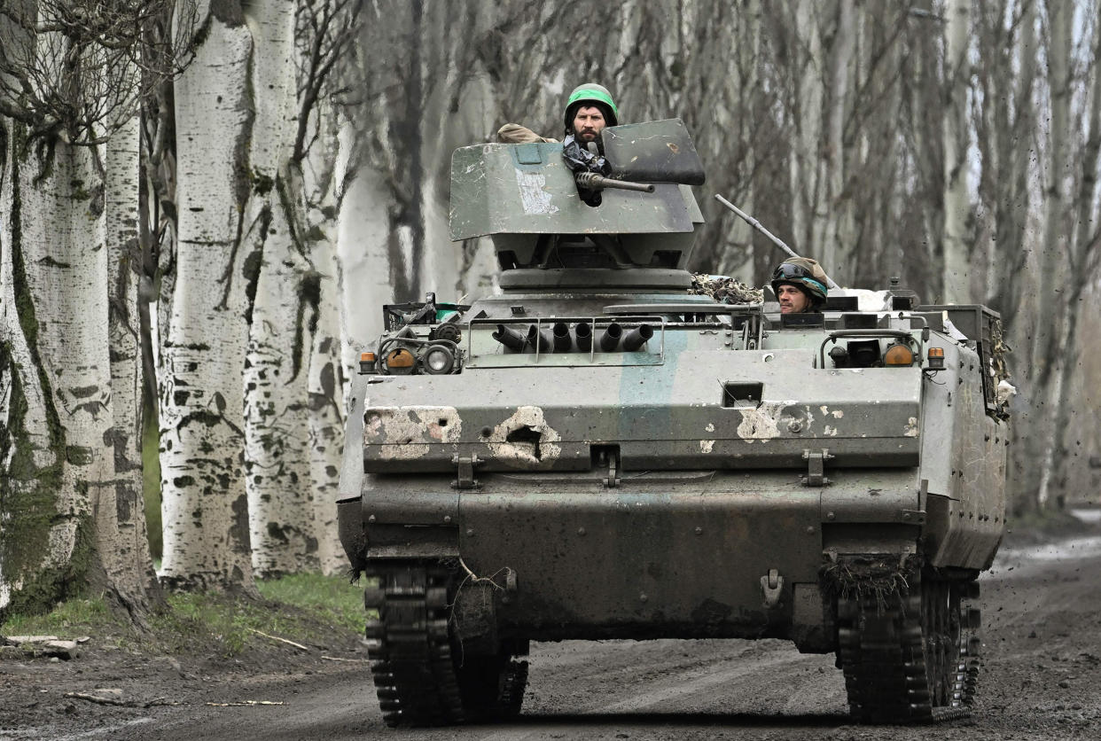 Ukrainian servicemen on a road near Bakhmut, Donetsk region, on April 6, 2023. (Genya Savilov / AFP - Getty Images)