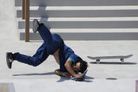 Kelvin Hoefler of Brazil tumbles during the men's street skateboarding finals at the 2020 Summer Olympics, Sunday, July 25, 2021, in Tokyo, Japan. (AP Photo/Jae C. Hong)