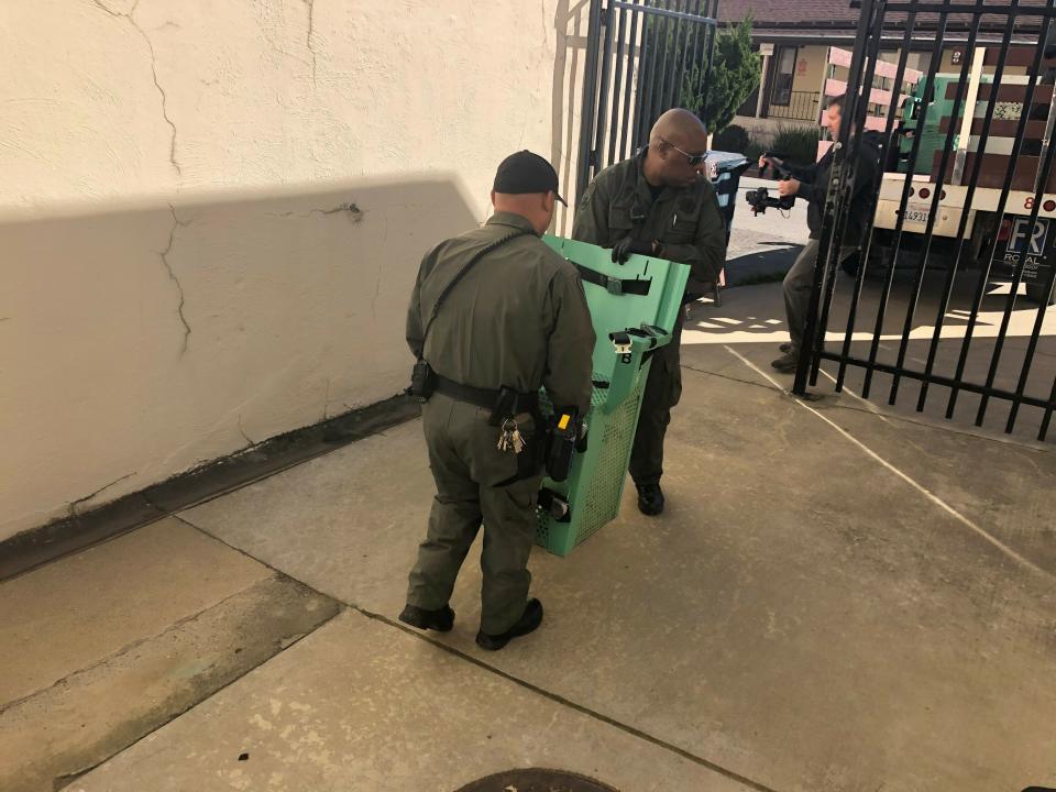 In this March 13, 2019, handout provided by the California Department of Corrections and Rehabilitation a death penalty chamber chair is carried to a truck at San Quentin State Prison, in San Quentin, Calif. Gov. Gavin Newsom signed an executive order, Wednesday, placing a moratorium on the death penalty. (California Department of Corrections and Rehabilitation via AP)