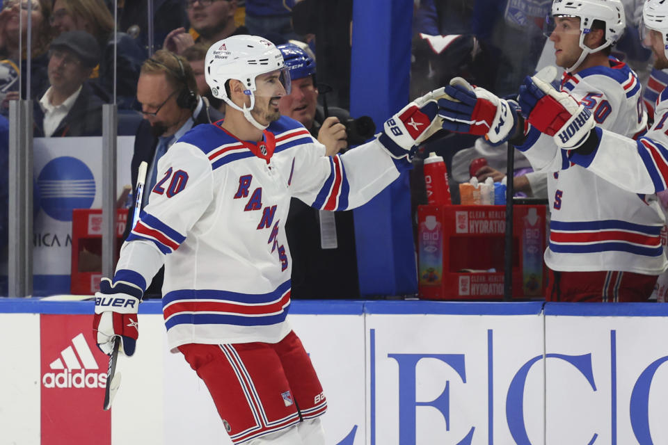 New York Rangers left wing Chris Kreider (20) is congratulated for his goal against the Buffalo Sabres during the first period of an NHL hockey game Thursday, Oct. 12, 2023, in Buffalo, N.Y. (AP Photo/Jeffrey T. Barnes)