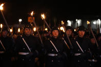 Honor guard's arrive for a Grand Tattoo ceremony to mark the farewell of German Chancellor Angela Merkel chancellorship in Berlin, Germany, Thursday, Dec. 2, 2021. With one week left before Merkel steps aside, she is being treated to a traditional send off involving the military ceremony with a brass band playing her choice of music. (AP Photo/Markus Schreiber)