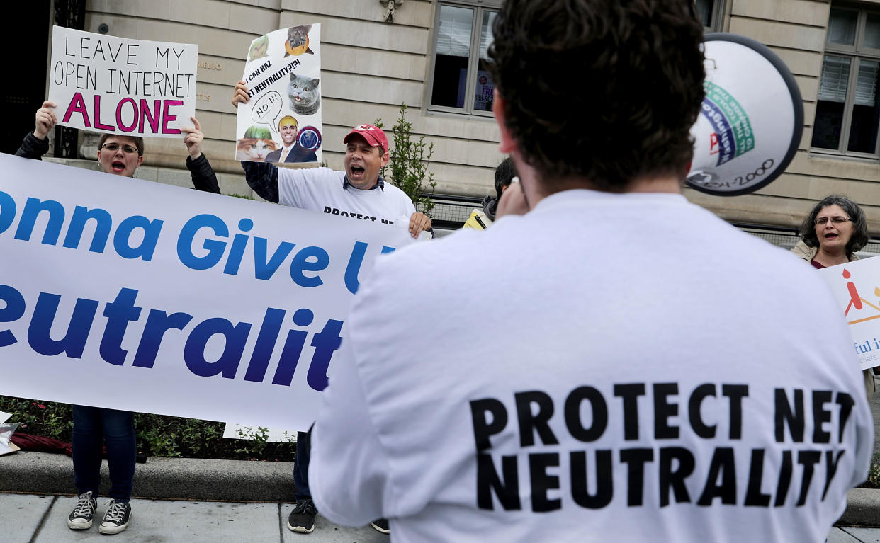 Proponents of net neutrality protest against Federal Communication Commission Chairman Ajit Pai outside the American Enterprise Institute/Getty Images