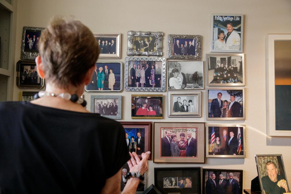 Ardith Marguleas stands near a wall in her Rancho Mirage home of photographs showing the people she and her late husband socialized with, including Leonore and Walter Annenberg and former President Gerald Ford and his wife, former First Lady Betty Ford.