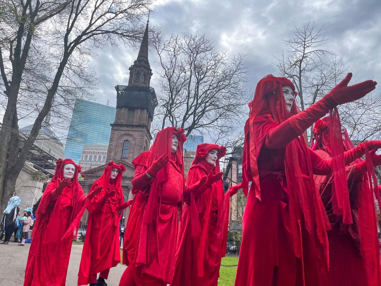 Members of Extinction Rebellion march on Boston Common in protest of climate change, April 21, 2024.