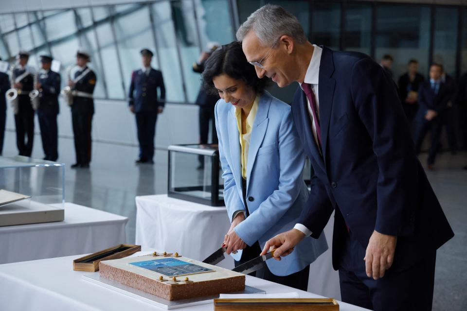 Belgian Minister for Foreign Affairs Hadja Lahbib (L) and North Atlantic Treaty Organization (NATO) Secretary General Jens Stoltenberg, cut the cake at the NATO Headquarters in Brussels on April 4, 2024.