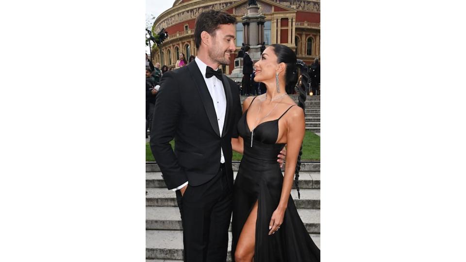 Thom Evans and Nicole Scherzinger look at each other