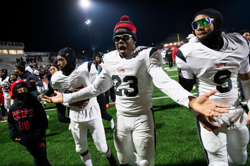 Aliquippa junior Tiqwai Hayes (23) asks "McDevitt, what happened?" after the Quips won the PIAA Class 4A football championship game against Dallas at Cumberland Valley High School, Thursday, Dec. 7, 2023, in Mechanicsburg, Pa. Bishop McDevitt defeated the Quips in last year's championship game but fell in the semifinals this season.