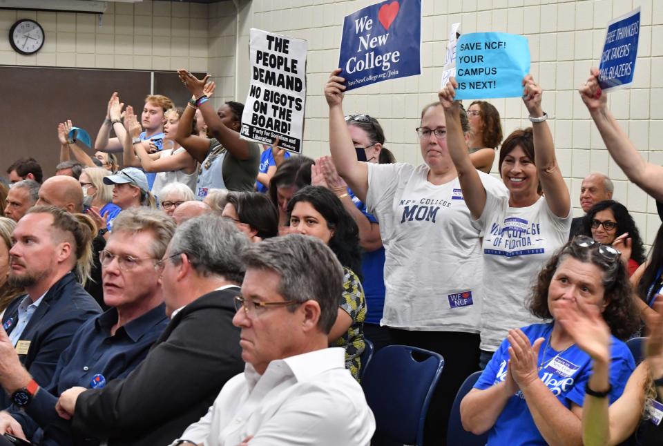 In an Aug. 31, 2023, photo, members of the audience stand and applaud remarks by a speaker at a New College of Florida board of trustees meeting in Sarasota. Emotions have run high since Gov. Ron DeSantis took over the progressive school.