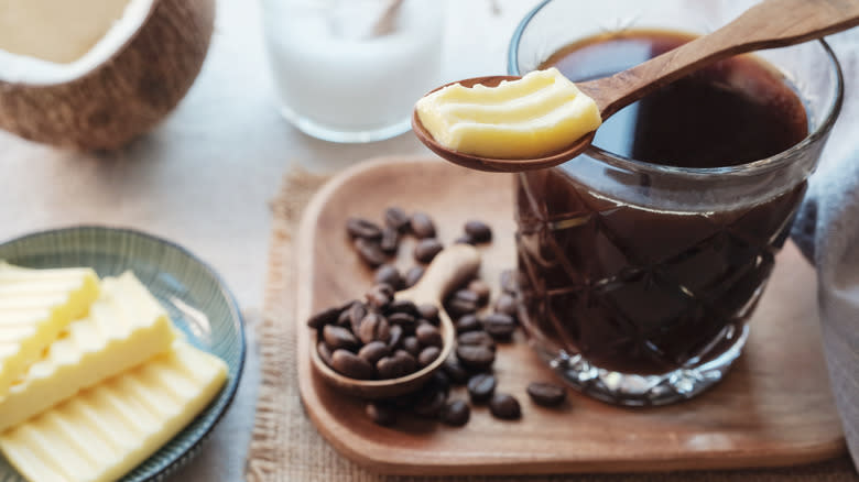 Spoonful of butter on coffee cup