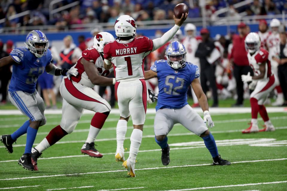 Detroit Lions outside linebacker Charles Harris (53) and linebacker Jessie Lemonier (52) put pressure on Arizona Cardinals quarterback Kyler Murray (1) during second half action on Sunday, Dec. 19, 2021, at Ford Field in Detroit.