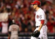 Homer Bailey #34 of the Cincinnati Reds walks to the dugout after striking out Brandon Crawford #35 of the San Francisco Giants to end the fifth inning in Game Three of the National League Division Series at the Great American Ball Park on October 9, 2012 in Cincinnati, Ohio. (Photo by Jonathan Daniel/Getty Images)