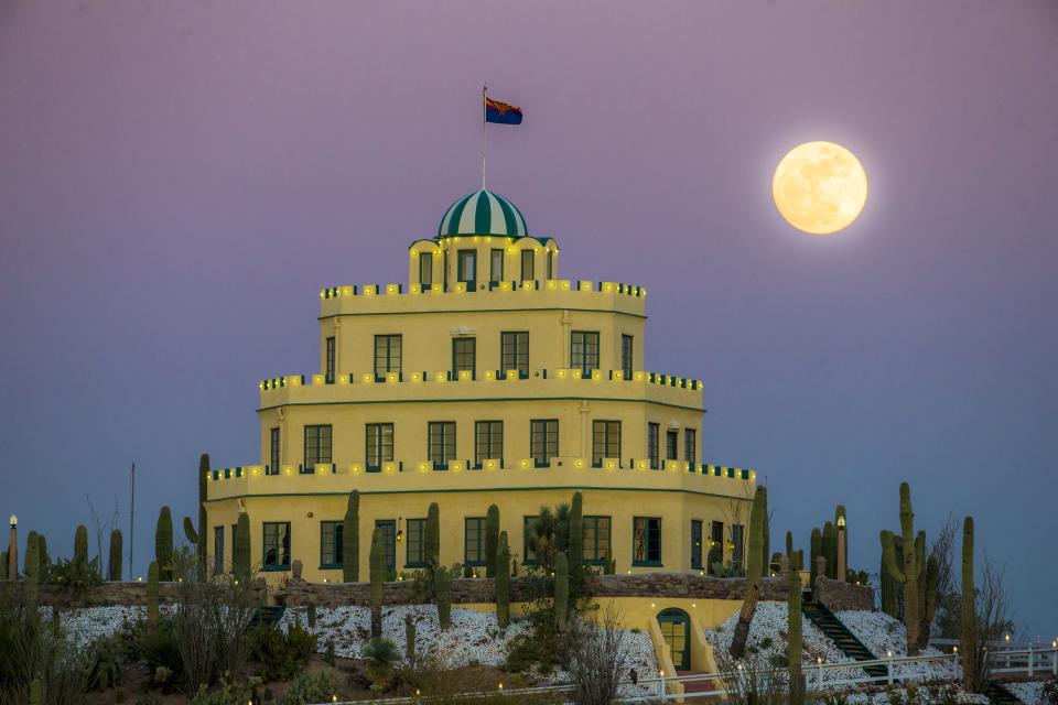 A nearly full moon rises behind Tovrea Castle in Phoenix on January 11, 2017. 