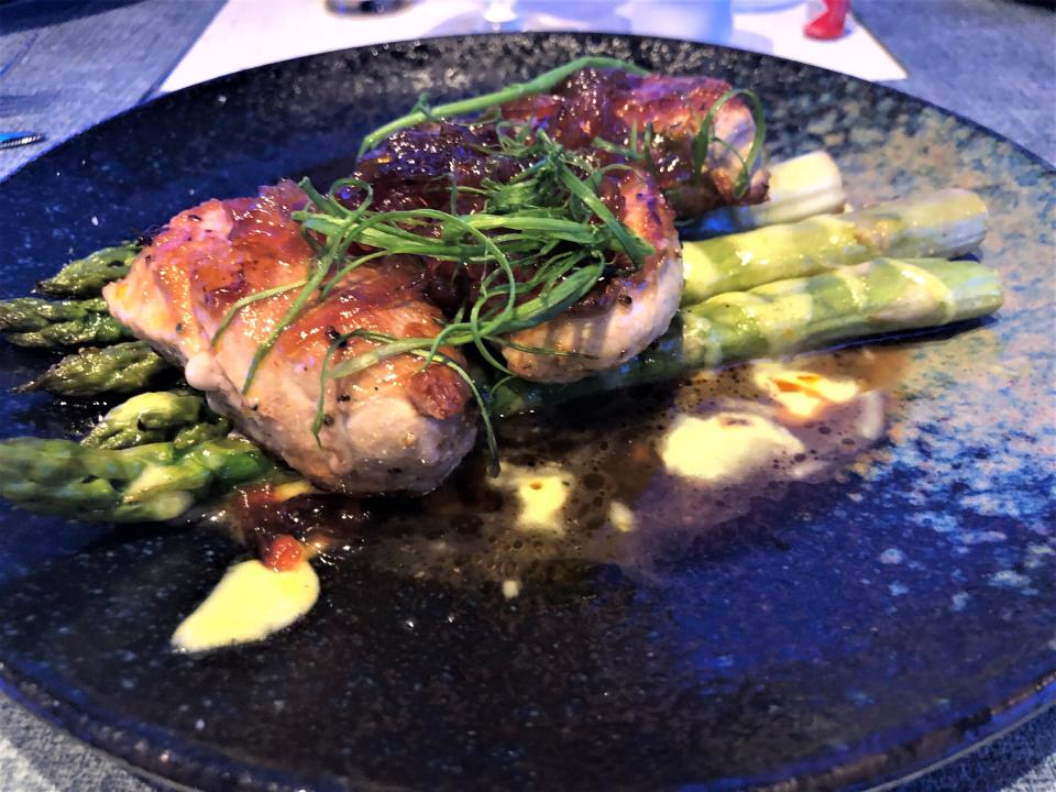 The pork tenderloin medallions at Kyle G's Oyster & Wine Bar were sautéed with a caramelized onion marmalade and served  with asparagus atop buttery hollandaise