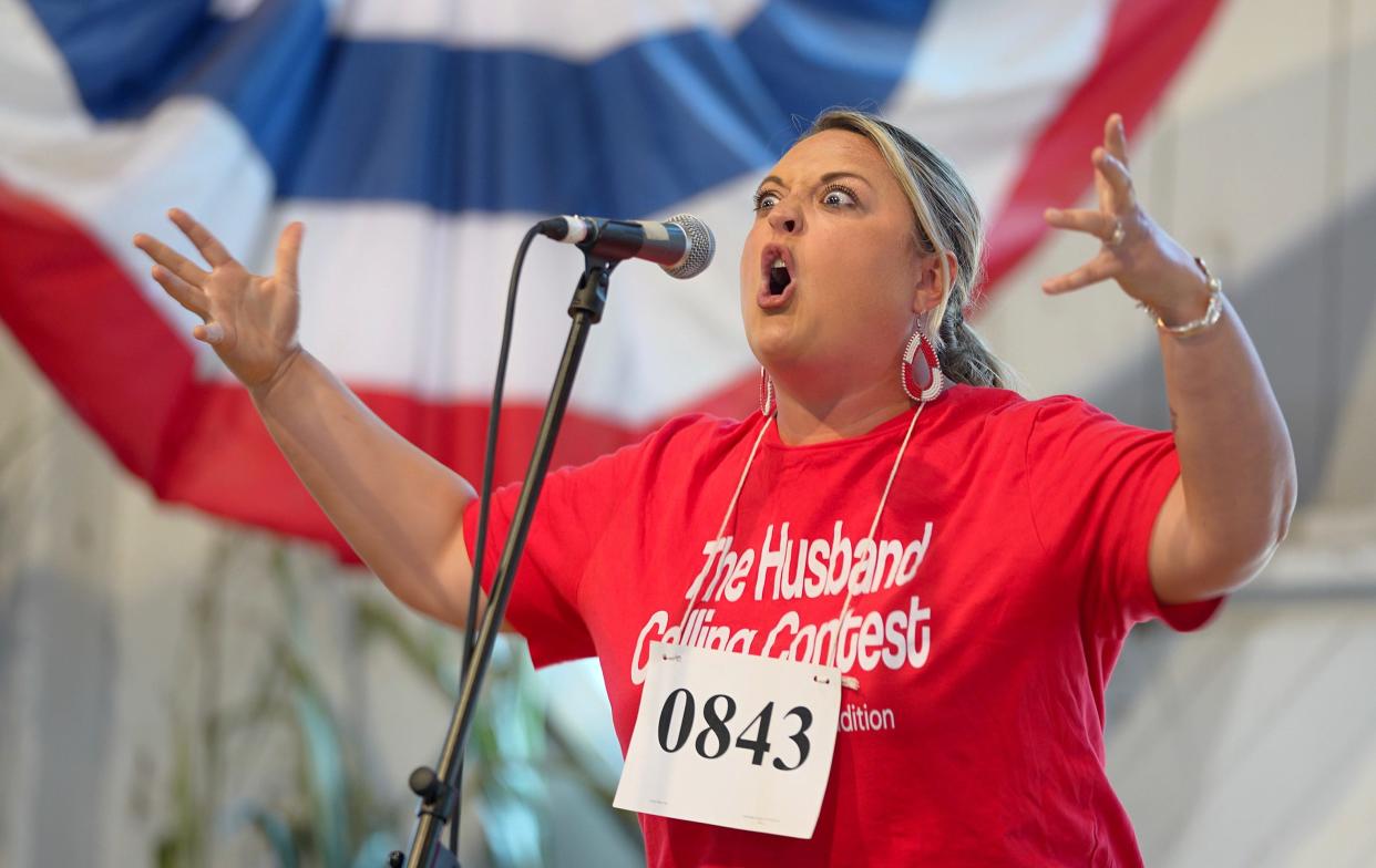 Wendy Joy Bryce of Onawa competes in the Husband Calling Contest at the Iowa State Fair, Friday, Aug. 18, 2023.