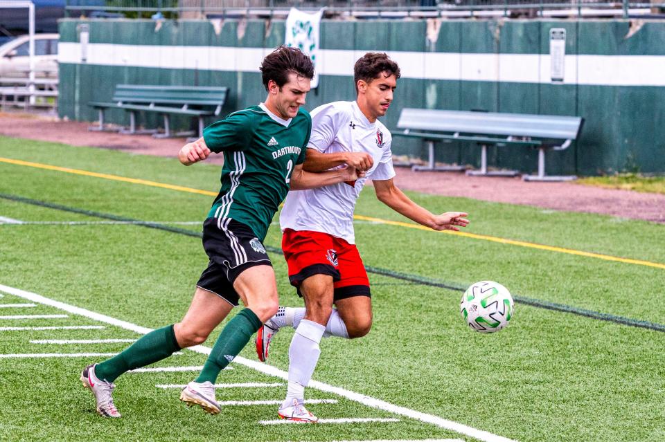 Dartmouth's Corey Melo battles for the loose ball with Durfee's Jake Silva.