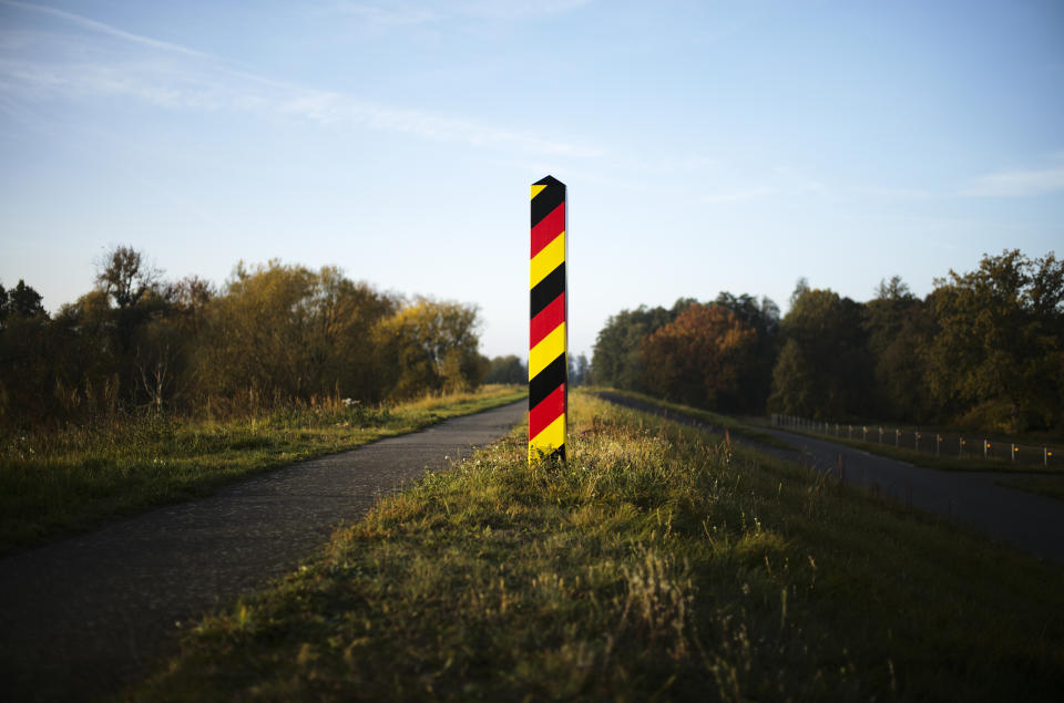 FILE --A border pole in German national colours mark the German border with Poland at the river Oder near the city Lebus, Germany, Oct. 28, 2021. Germany will increase its police patrols along "smuggling routes" on the border with Poland the Czech Republic in an effort to prevent more migrants from entering the country, it was announced Wednesday, Sept. 27, 2023 (AP Photo/Markus Schreiber, File)
