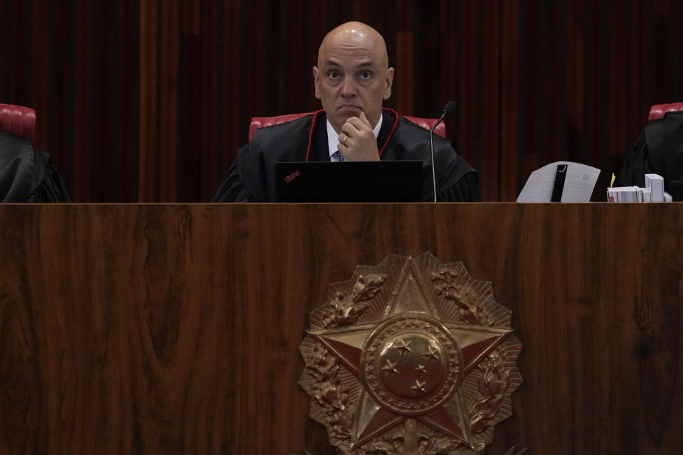 President of the Supreme Electoral Court, Minister Alexandre de Moraes, presides over the trial of former President Jair Bolsonaro at the Supreme Court in Brasilia, Brazil, Friday, June 30, 2023. Judges continue evaluating the case which claims Bolsonaro abused his power by using government communication channels to promote his campaign and cast unfounded doubts on the country's electronic voting system. (AP Photo/Eraldo Peres)