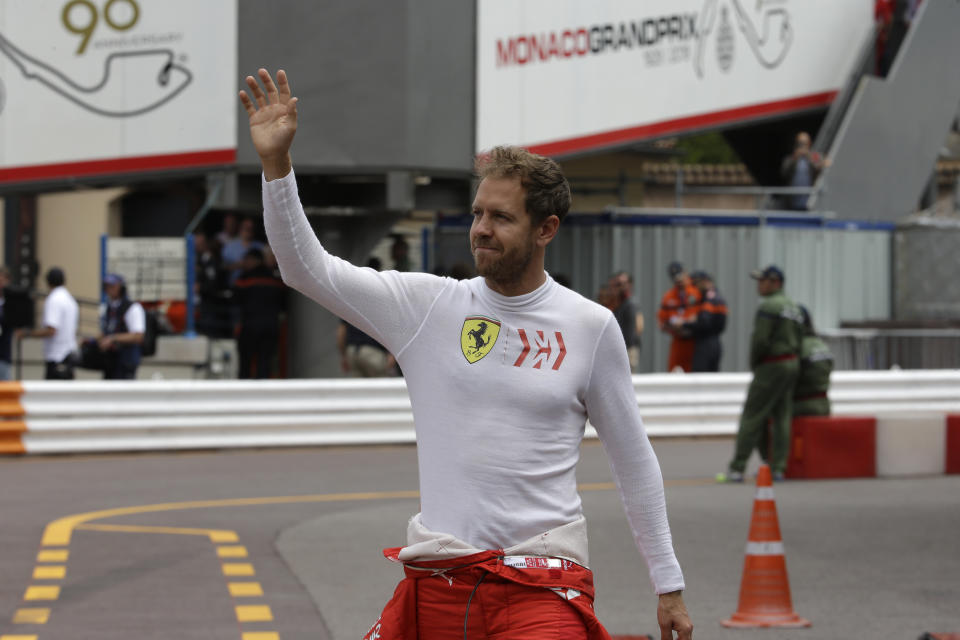 Ferrari driver Sebastian Vettel of Germany waves to the crowd during the second practice session at the Monaco racetrack, in Monaco, Thursday, May 23, 2019. The Formula one race will be held on Sunday. (AP Photo/Luca Bruno)