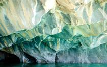 <p>These <a rel="nofollow noopener" href="http://www.travelandleisure.com/photography/marble-caves-chile" target="_blank" data-ylk="slk:beautiful caves;elm:context_link;itc:0;sec:content-canvas" class="link ">beautiful caves</a> change color depending on the color of the water. The gentle curves of the rock walls make it easier for sunlight to bounce around, reflecting the blues below.</p>