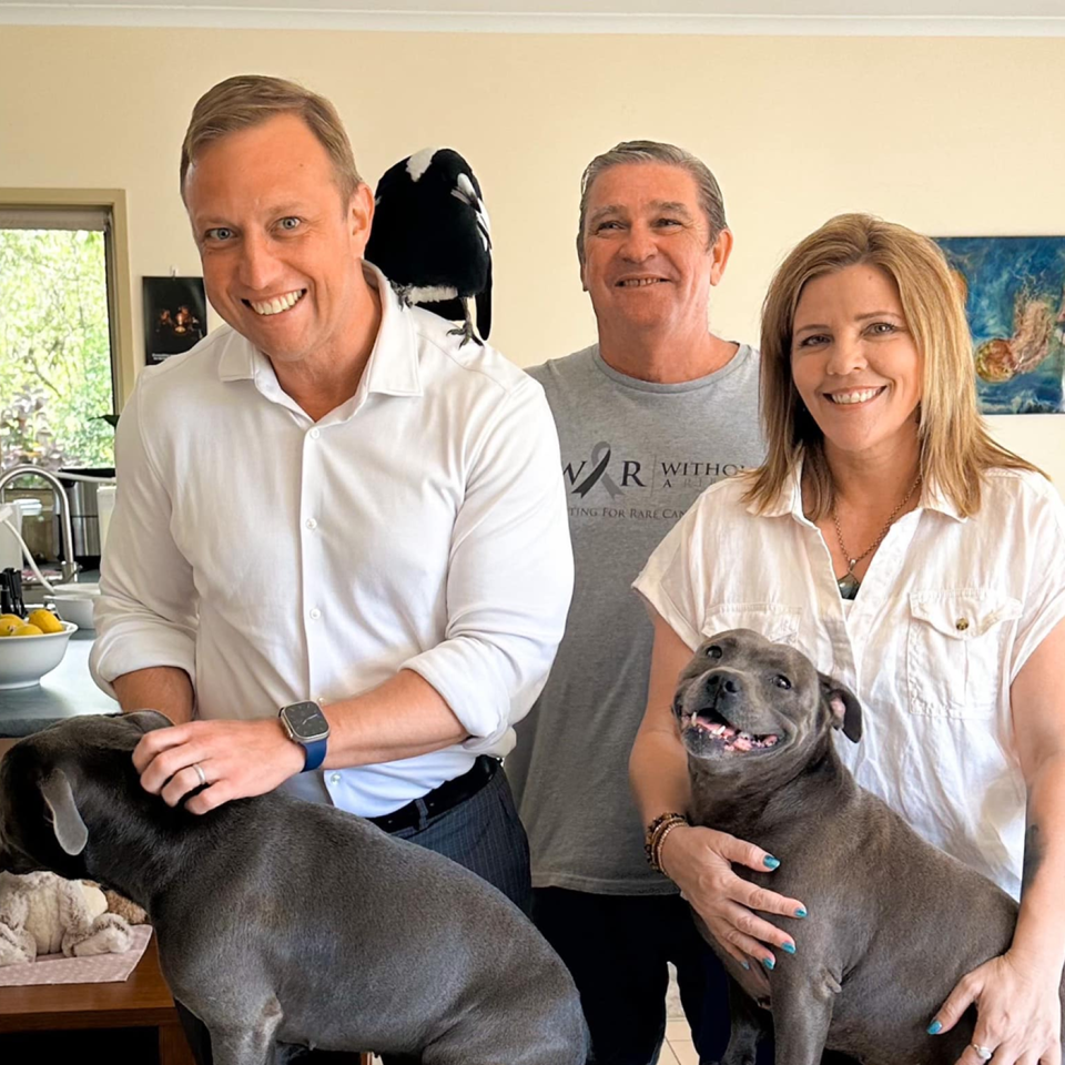 Premier Steven Miles standing next to Reece Mortensen, Juliette Wells, Peggy, Molly and Ruby.