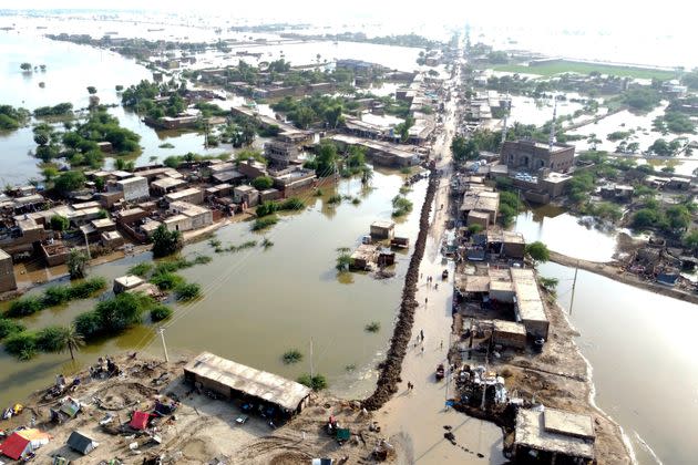 Homes are surrounded by floodwaters in Sohbat Pur city of Jaffarabad, a district of Pakistan's southwestern Baluchistan province on Aug. 29, 2022. (Photo: Zahid Hussain via AP)