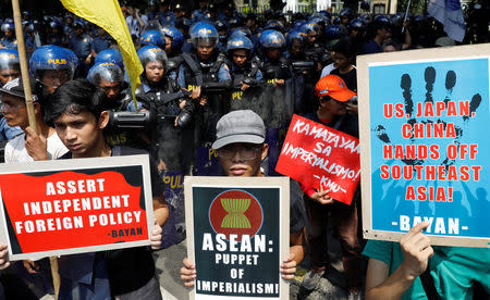 Demonstrators display placards against U.S., Japan, China and the Association of Southeast Asian Nations (ASEAN) during a rally ahead of the ASEAN summit in Manila, Philippines April 28, 2017. REUTERS/Erik De Castro