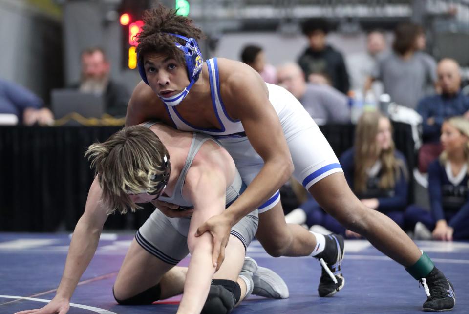 Stillwater's LaDarion Lockett, top, wrestles Edmond North's Brayden Lucas in the Class 6A 157-pound match during the dual state tournament finals at Stride Bank Center in Enid on Feb. 11.