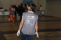 A staff member is seen at the Vaccination Centre of Hope at the Cape Town International Convention Centre in Cape Town, South Africa, Friday, Dec. 3, 2021. The mass Covid-19 vaccination site is closing today after vaccinating more than 136 000 people at the Western Cape's first mass vaccination centre. (AP Photo/Nardus Engelbrecht)