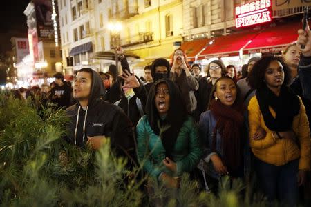 Demonstrators chant against the police during a demonstration against the grand jury decision in the Ferguson, Missouri shooting of Michael Brown in San Francisco, California November 28, 2014. REUTERS/Stephen Lam