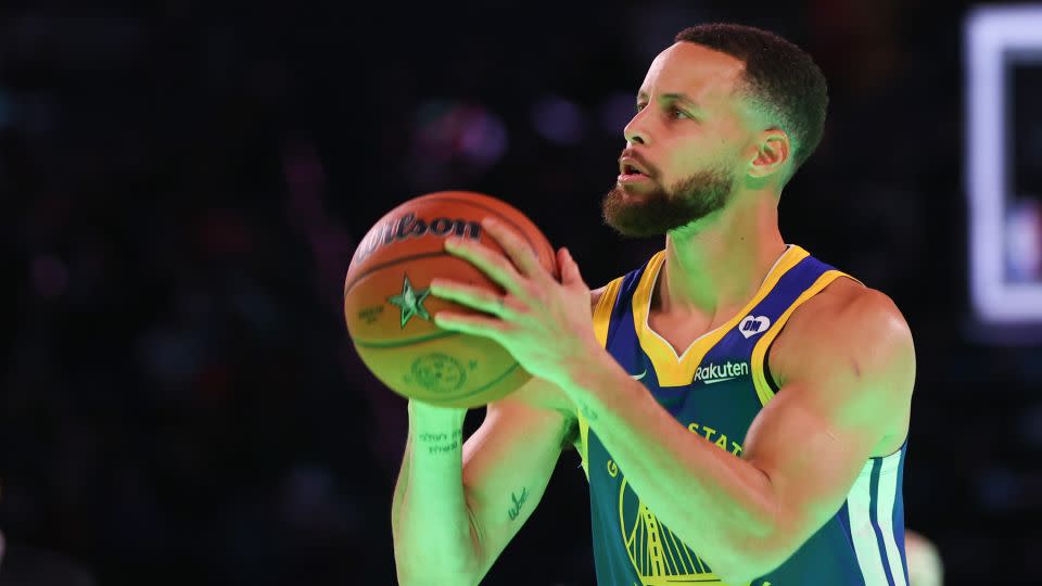 Stephen Curry prepares to shoot in the three-point challenge against Sabrina Ionescu. - Stacy Revere/Getty Images