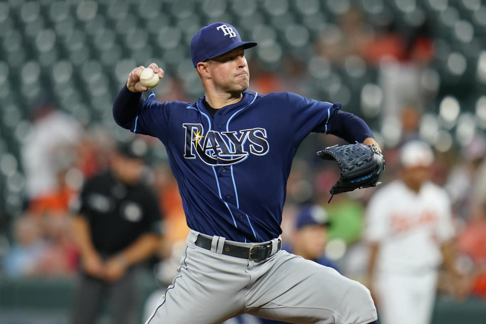 Tampa Bay Rays starting pitcher Corey Kluber throws a pitch to the Baltimore Orioles during the third inning of a baseball game, Monday, July 25, 2022, in Baltimore. (AP Photo/Julio Cortez)