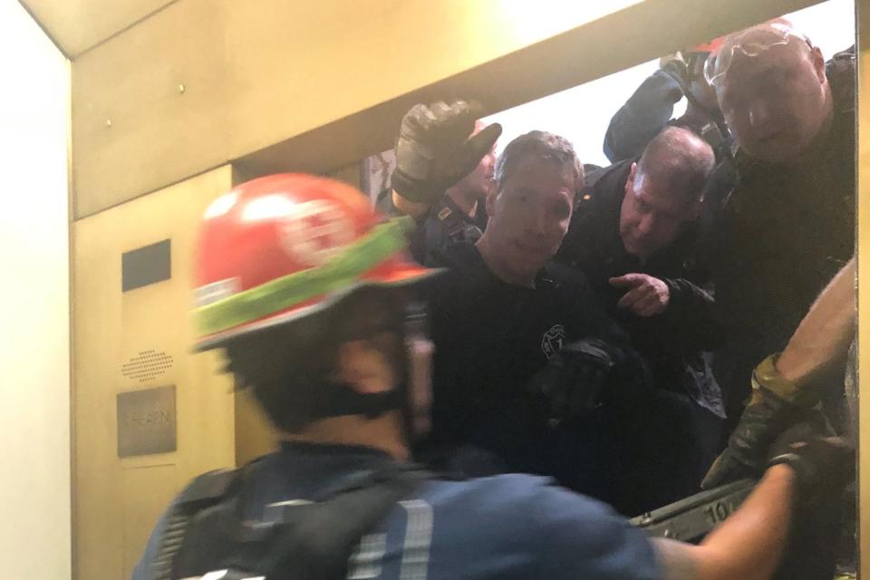 Rescue crew open the door to pull out six people trapped in an elevator: REUTERS