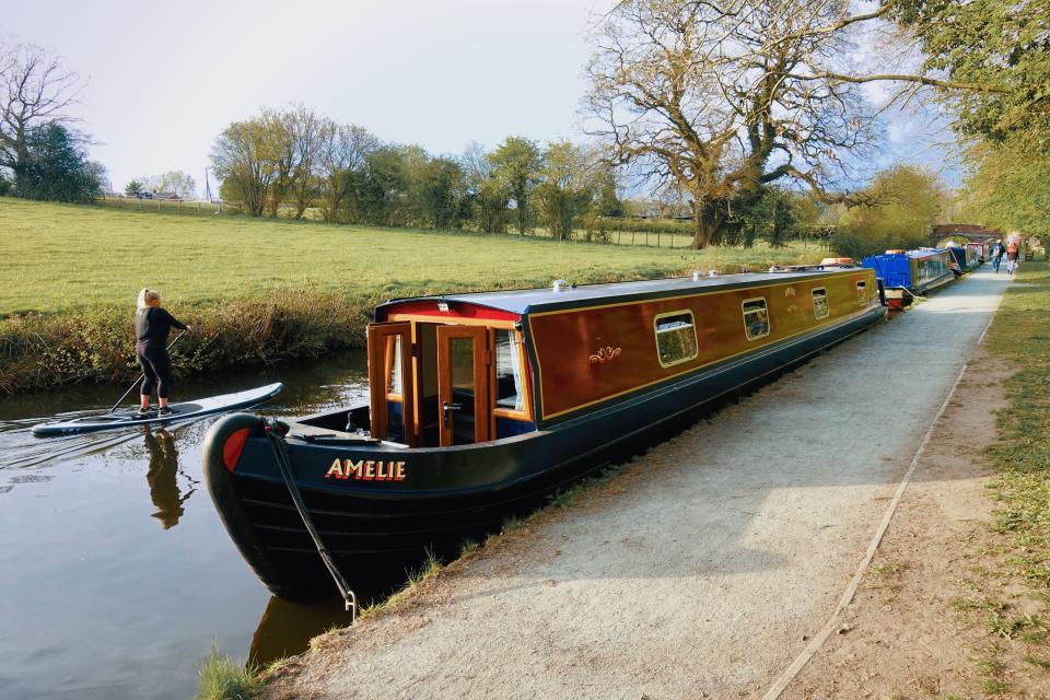 <p>Trying to steer a 62ft two-bedroom narrowboat takes a fair amount of concentration</p> (Adam Batterbee)