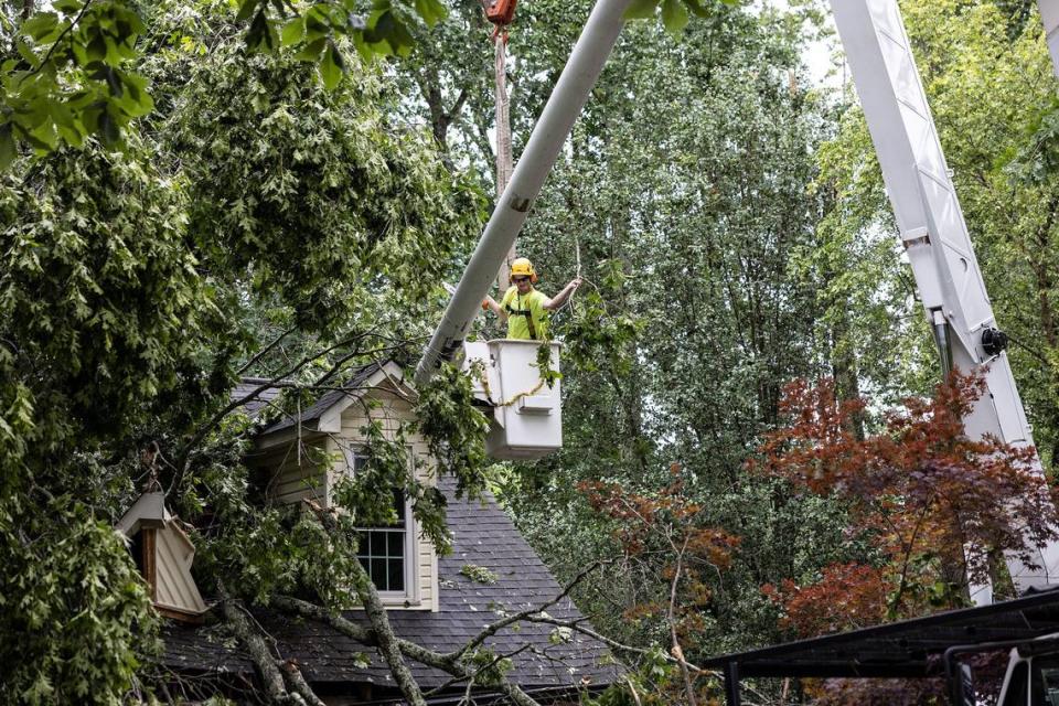 A crew works to clear tornado damage from Scottie Wolds home in Harrisburg, N.C., on Tuesday, May 24, 2022. Another round of severe weather is expected in the Charlotte area on Thursday, May 26, 2022, the National Weather Service says.