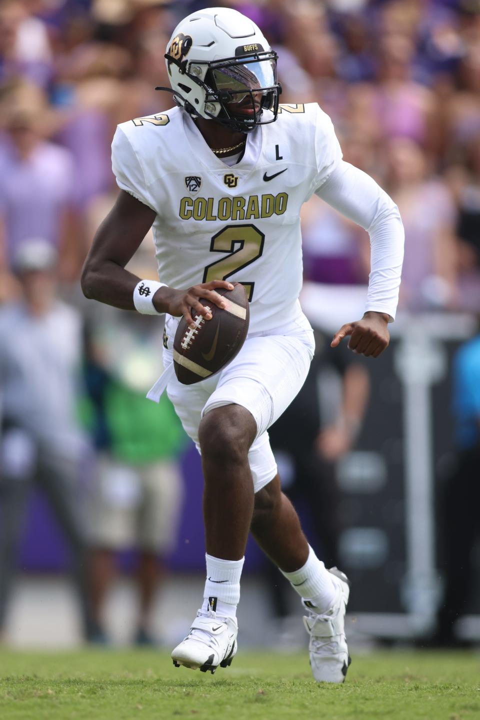 Colorado Buffaloes quarterback Shedeur Sanders (2) rolls out to pass in the second quarter against the TCU Horned Frogs at Amon G. Carter Stadium Sept. 2, 2023, in Fort Worth, Texas.