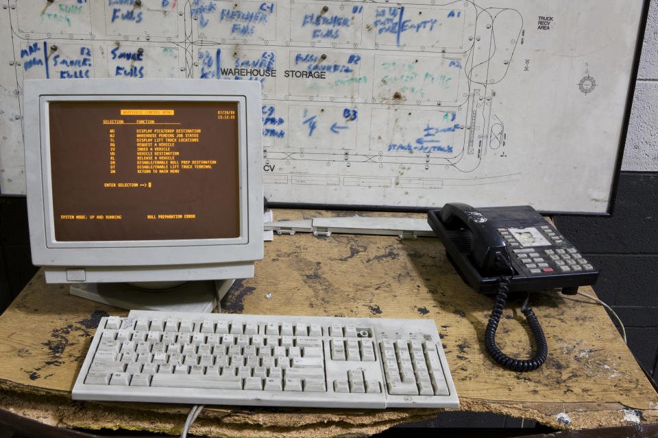 A vintage computer and telephone