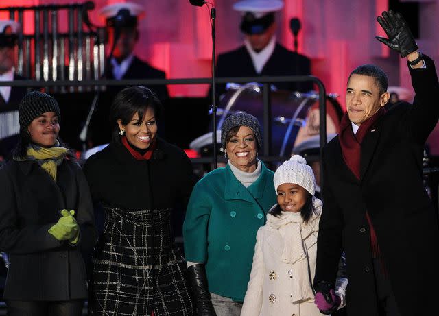 <p>Alex Wong/Getty</p> Barack Obama, with his daughters Sasha and Malia, mother-in-law Marian Robinson, and Michelle Obama at the 2010 National Christmas Tree lighting ceremony on December 9, 2010 in Washington, DC.