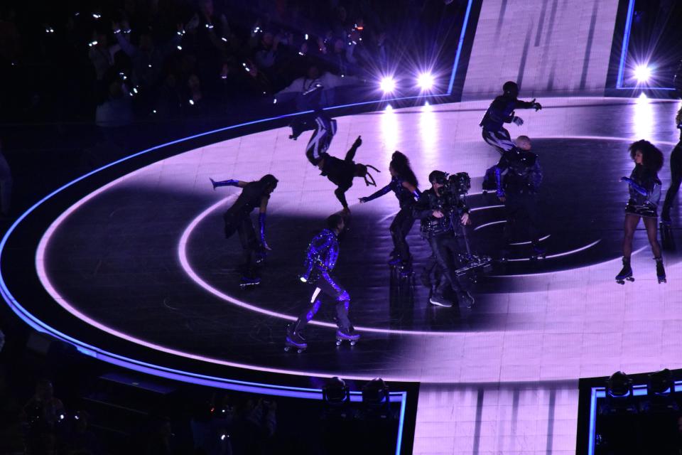 Usher skates around the Halftime Show stage