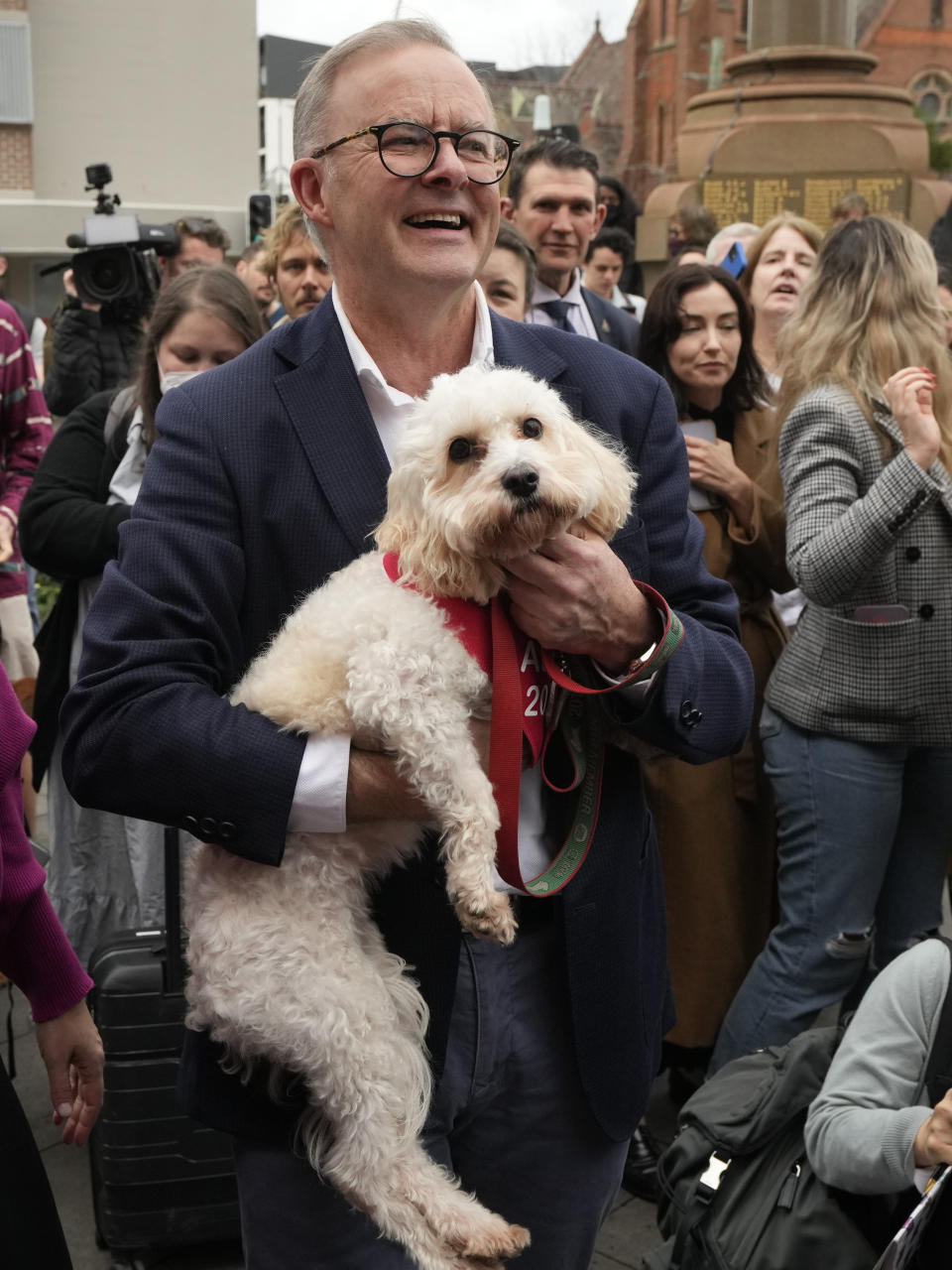 Labor Party leader Anthony Albanese holds his dog, Toto, after voting in Sydney, Australia, Saturday, May 21, 2022. Australians go to the polls following a six-week election campaign that has focused on pandemic-fueled inflation, climate change and fears of a Chinese military outpost being established less than 1,200 miles off Australia's shore. (AP Photo/Rick Rycroft)