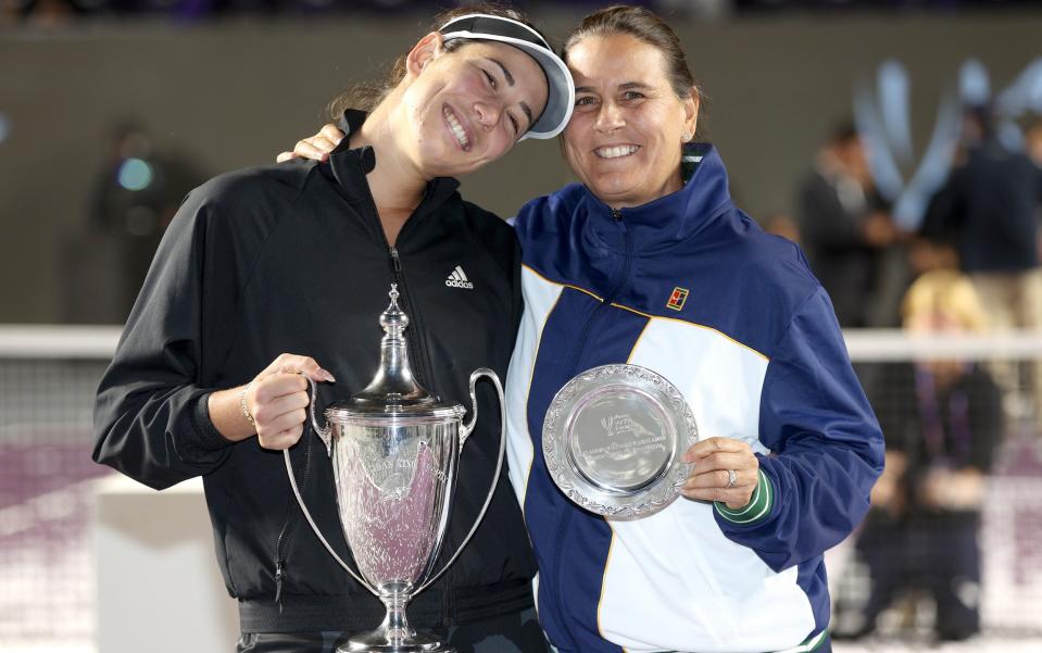 Garbine Muguruza and Conchita Martinez hug