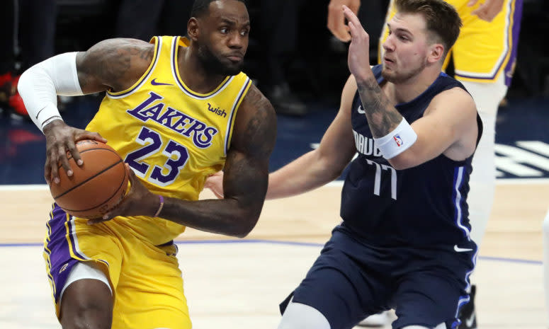 LeBron James drives against Luka Doncic.