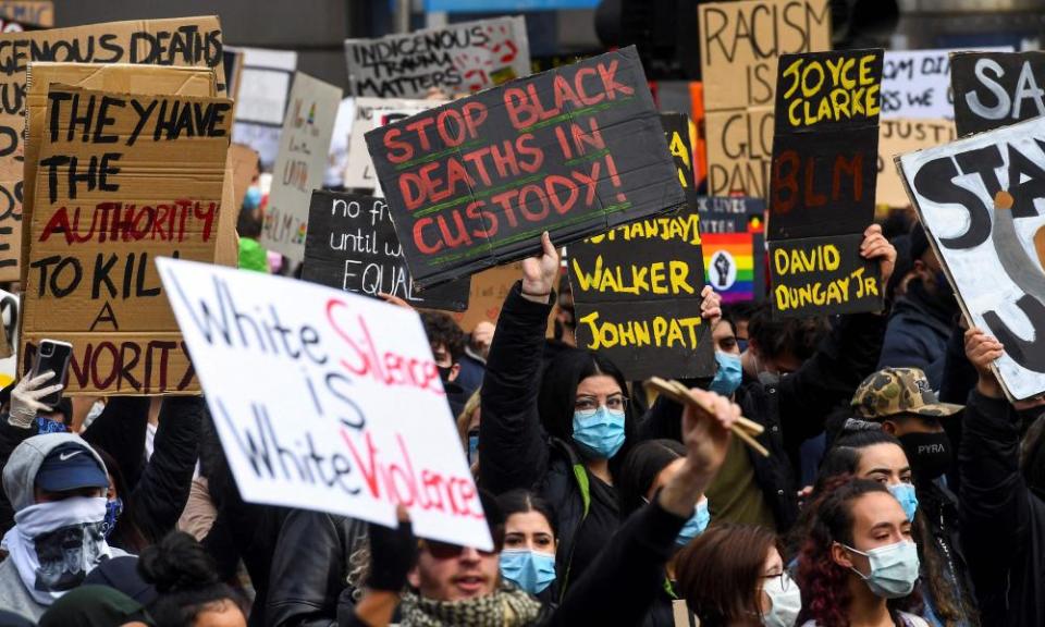 Demonstrators demand an end to frequent Aboriginal deaths in custody in Australia at a protest in Melbourne.