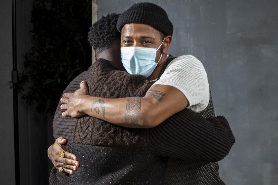 "Judas and the Black Messiah" stars Daniel Kaluuya and LaKeith Stanfield embrace.