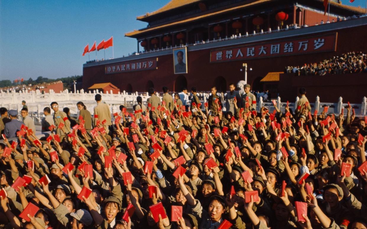  Red Guards brandish Mao’s Little Red Book in 1966 - Getty Images