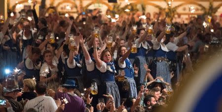 Oktoberfest waitresses celebrate the end of the world's biggest beer festival, the 181st Oktoberfest, in Munich October 5, 2014. REUTERS/Lukas Barth