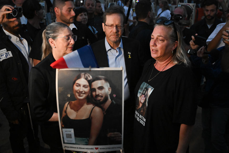 Israeli President Isaac Herzog and his wife visit relatives of victims and attend a memorial ceremony at the Nova Music Festival site to mark one full year since Hamas attacked the festival and other sites across southern Israel, Oct. 7, 2024 in Re'im, Israel. / Credit: ALEXI ROSENFELN/Getty