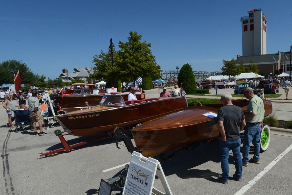 Visitors check out some of the wooden boats on display on the grounds of the Door County Maritime Museum in Sturgeon Bay at the 2021 Classic and Wooden Boat Show. The 2023 show takes place at the museum Aug. 5 and 6